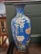 A JAPANESE CLOISONNE BLUE GROUND BALUSTER VASE ENAMELLED WITH CHRYSANTHEMUMS AND LILIES GROWING