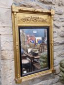 AN EARLY 19th C. RECTANGULAR MIRROR WITHIN A REEDED EBONY SLIP AND COLUMNAR FRAME CRESTED BY A