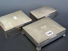 THREE HALLMARKED SILVER CIGARETTE BOXES, ONE HAMMERED AND THE OTHERS ENGINE TURNED, EACH WITH WOODEN