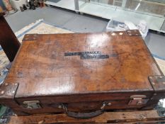 AN EARLY 20th C.LEATHER SUITCASE WITH ELECTROPLATED LOCK PLATES