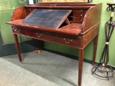 A GEORGIAN MAHOGANY CARLTON HOUSE DESK, THE TAMBOUR LID ENCLOSING PIGEON HOLES AND DRAWERS BEHIND