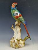 A MEISSEN PORCELAIN FIGURE OF A PARROT PERCHED ON A TREE TRUNK, CROSSED SWORDS MARK. H 32cms.