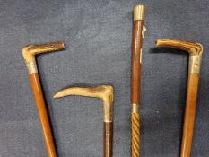 FOUR HUNTING WHIPS WITH ELECTROPLATE BANDS, THREE WITH ANTLER HANDLES
