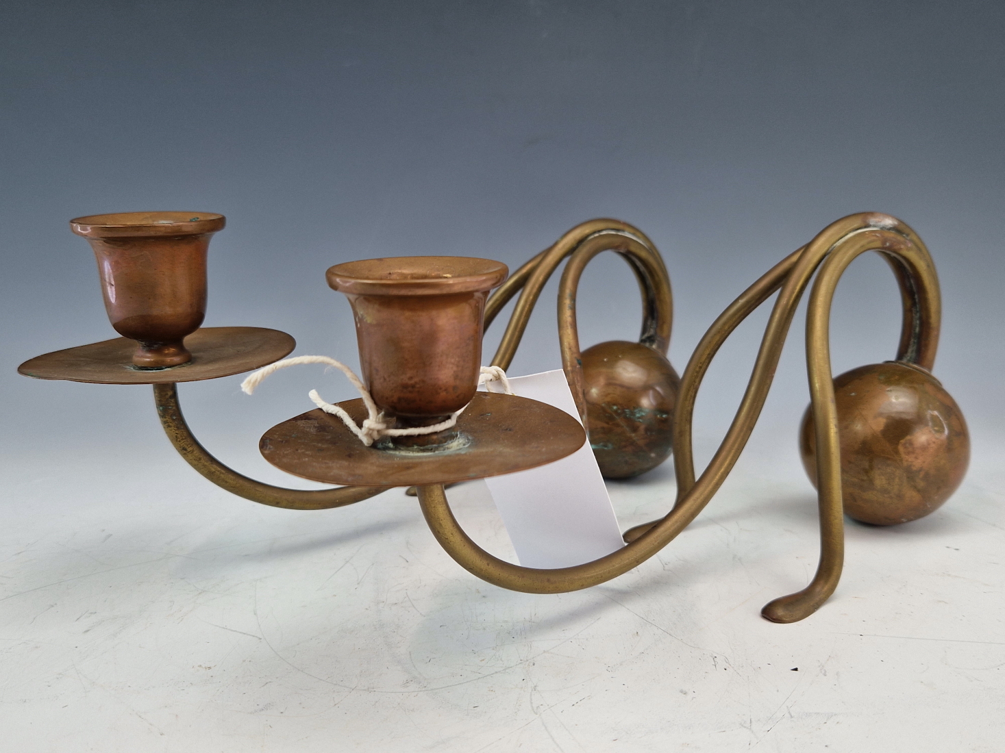 A PAIR OF BENSON BRASS AND COPPER COUNTERWEIGHT CANDLESTICKS, POSSIBLY TO A CHRISTOPHER DRESSER