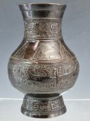 A CHINESE BRONZE BALUSTER VASE CAST WITH BANDS OF DAODIEH AND WITH CHEVRON LAPPETS ON THE SHOULDERS.