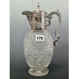 A CUT GLASS CLARET JUG SILVER MOUNTED BY LEE AND WIGFUL, SHEFFIELD 1899, A MASK SPOUT TO ONE SIDE OF
