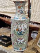 A CHINESE VASE PAINTED WITH FLOWER AND BUTTERFLY RESERVES ON A PALE GREEN GROUND WITH SCROLLING