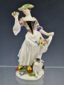 AN 18th C. MEISSEN FIGURE OF A SHEPHERDESS AFTER THE MODEL BY KANDLER AND REINICKE, SHE STANDS