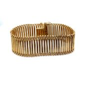 A LADDER STYLE GOLD BRACELET. LENGTH 19.5cms. UNHALLMARKED, STAMPED 444VI 750, WITH EGYPTIAN MARKS