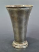 A SWEDISH SILVER BEAKER WITH A SHEFFIELD IMPORT MARK FOR 2008, THE SIDES FLARING FROM THE