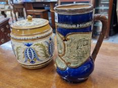 A DOULTON SILVER MOUNTED NELSON COMMEMORATIVE JUG, THE SILVER LONDON 1905 TOGETHER WITH A VILLEROY