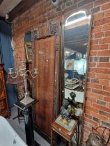 A PAIR OF RECTANGULAR BEVELLED GLASS MIRRORS IN GILT FRAMES WITH ROUNDED TOPS, EACH. 250 x 47cms.