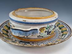 A 19th C. MAJOLICA DISH PAINTED WITH TWO BIRDS PERCHED CENTRALLY TO A RIBBON RIME BAND. Dia.