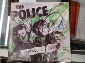 THE POLICE - MESSAGE IN A BOTTLE 7" GREEN VINYL SIGNED BY STING & STEWART COPELAND