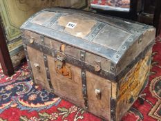 AN IRON BOUND AND LEATHER MOUNTED SMALL CHEST WITH A ROUND ARCH. W 40cms.lm