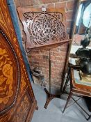 A LATE VICTORIAN MAHOGANY MUSIC LECTERN RISING ON A BRASS POLE FROM AN IRON TRIPARTITE FOOT