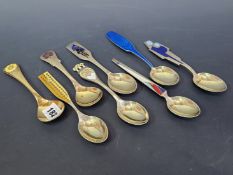 A SET OF DANISH ENAMELLED STERLING SILVER GILT SPOONS BY MICHELSEN, COPENHAGEN AND DATED FOR JULY