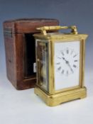 A LEATHER CASED DROCOURT CARRIAGE CLOCK STRIKING ON A COILED ROD, THE DIAL OF WHITE ENAMEL