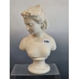 A PARRIAN WARE BUST OF A YOUNG LADY ON A SOCLE BASE. 28 cm HIGH.