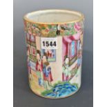 A CANTON CYLINDRICAL VASE PAINTED WITH LADIES IN AND ABOUT A PAVILION. H 16.5cms.
