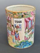 A CANTON CYLINDRICAL VASE PAINTED WITH LADIES IN AND ABOUT A PAVILION. H 16.5cms.