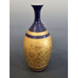 A JAPANESE PORCELAIN BALUSTER VASE WITH BLUE BANDS ABOVE THE GILT BODY WITH RAISED SCROLLING LOTUS
