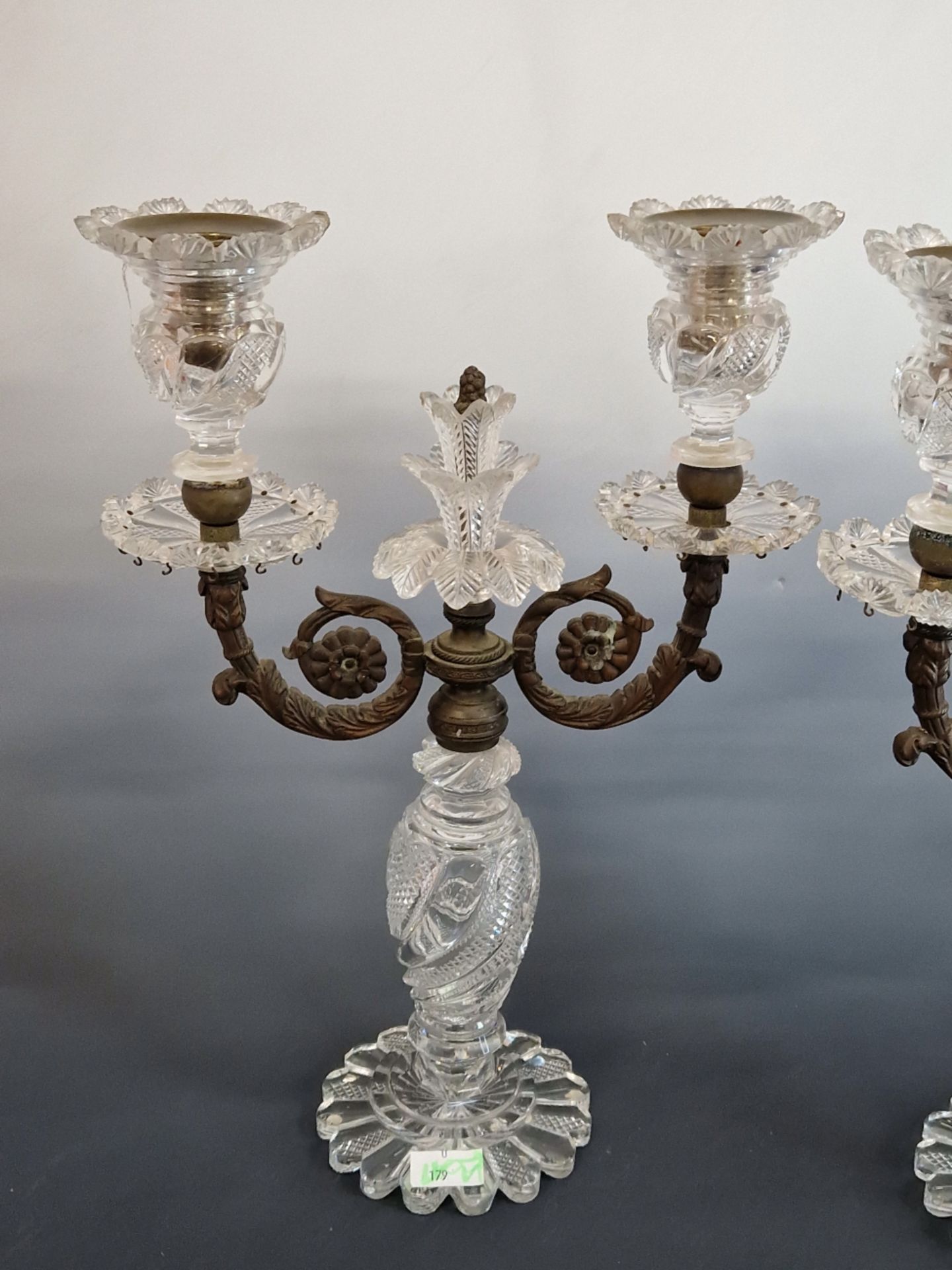 A PAIR OF CUT GLASS AND BRONZE TWO LIGHT LUSTRE CANDELABRA SUPPORTED ON PETAL FEET. H 34cms. - Image 3 of 6