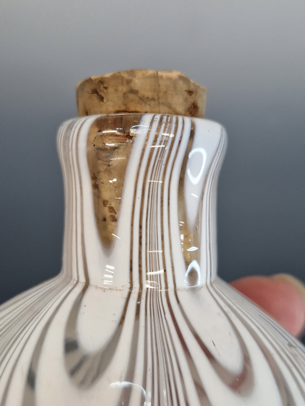 A CLEAR GLASS FLASK LOOPED WITH WHITE BANDS. H 17cms. - Image 4 of 5