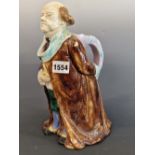 ATTRIBUTED TO SARREGUEMINES, A MAJOLICA JUG MODELLED AS A GENTLEMAN WEARING A TURQUOISE TRIMMED