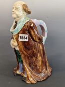 ATTRIBUTED TO SARREGUEMINES, A MAJOLICA JUG MODELLED AS A GENTLEMAN WEARING A TURQUOISE TRIMMED
