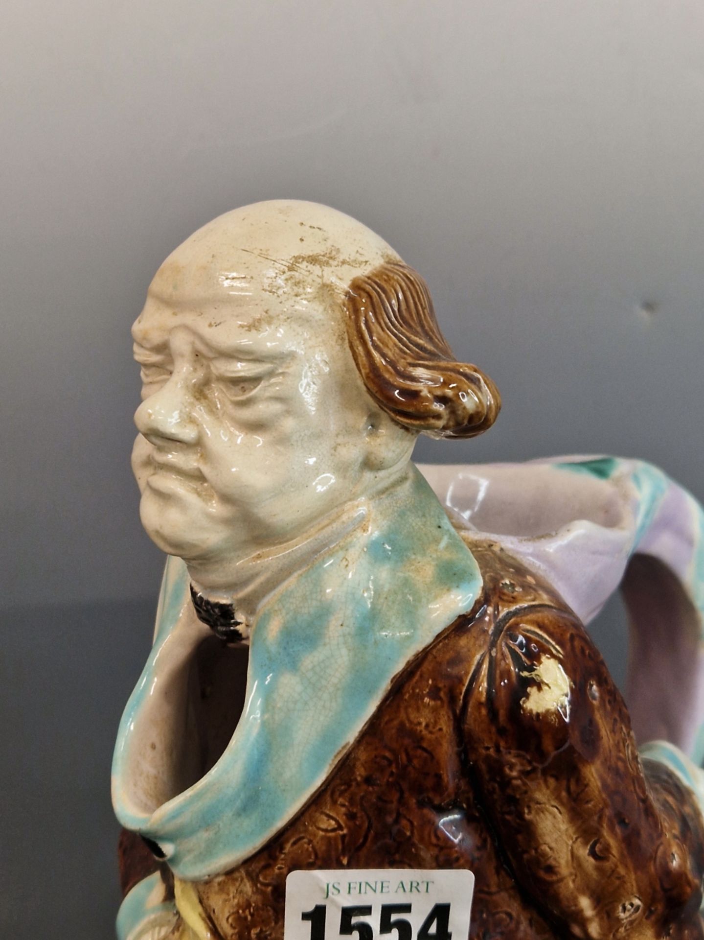ATTRIBUTED TO SARREGUEMINES, A MAJOLICA JUG MODELLED AS A GENTLEMAN WEARING A TURQUOISE TRIMMED - Image 2 of 5