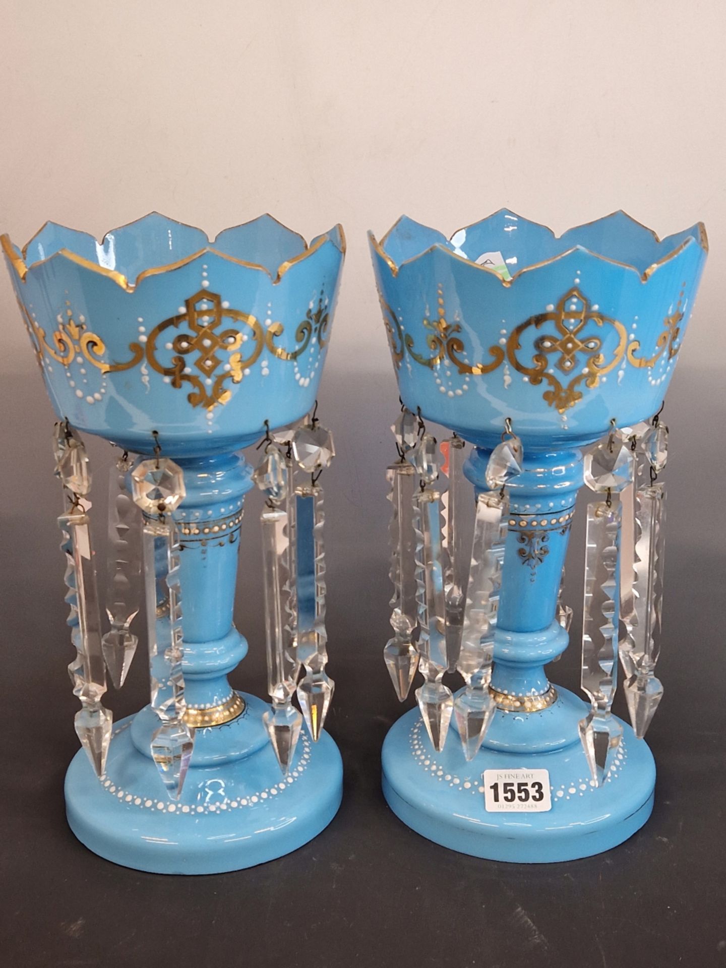 A PAIR OF LATE 19th C. BOHEMIAN SKY BLUE GLASS LUSTRES, THE CROWN TOPS GILT WITH SCROLL BANDS ABOVE