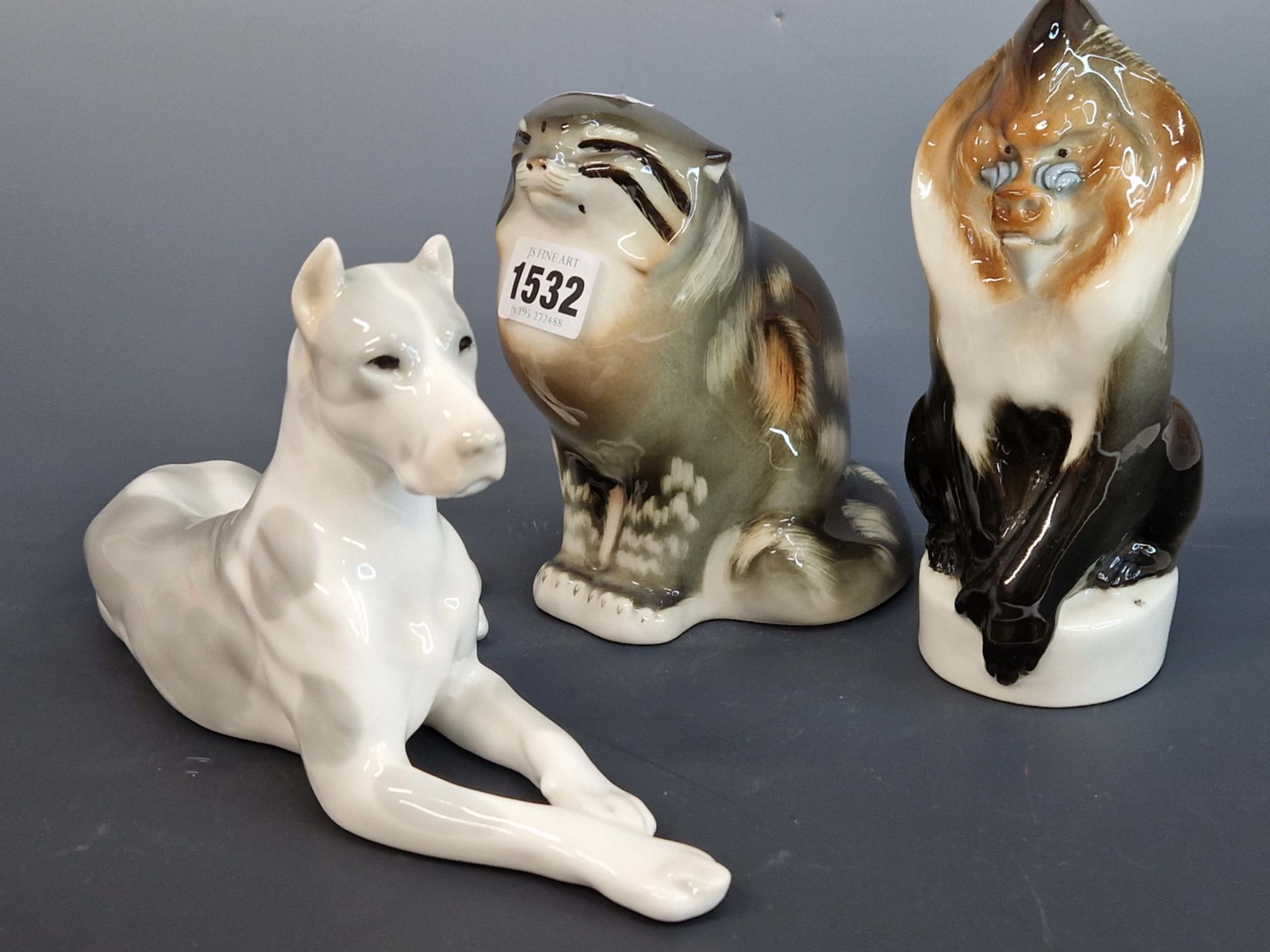 THREE LOMONOSOV PORCELAIN ANIMALS, A DOG, A CAT AND A MONKEY