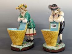 A PAIR OF MINTON MAJOLICA FIGURAL SWEETMEATS, DATE SYMBOL FOR 1870, THE MALE AND FEMALE IN 18th C.