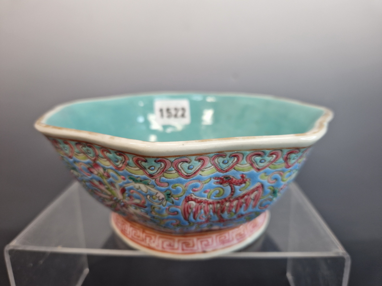 A CANTON OCTAGONAL BLUE GROUND BOWL, THE EXTERIOR PAINTED WITH PHOENIX ALTERNATING WITH LOTUS