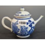 A CHINESE BLUE AND WHITE TEA POT AND COVER PAINTED ON EACH SIDE WITH PINE AND PEONY GROWING BY A