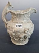 A 19THCENTURY GREY POTTERY RELIEF MOULDED JUG DECORATED WITH FOX FAMILY AND HOUNDS. 22 cm HIGH.