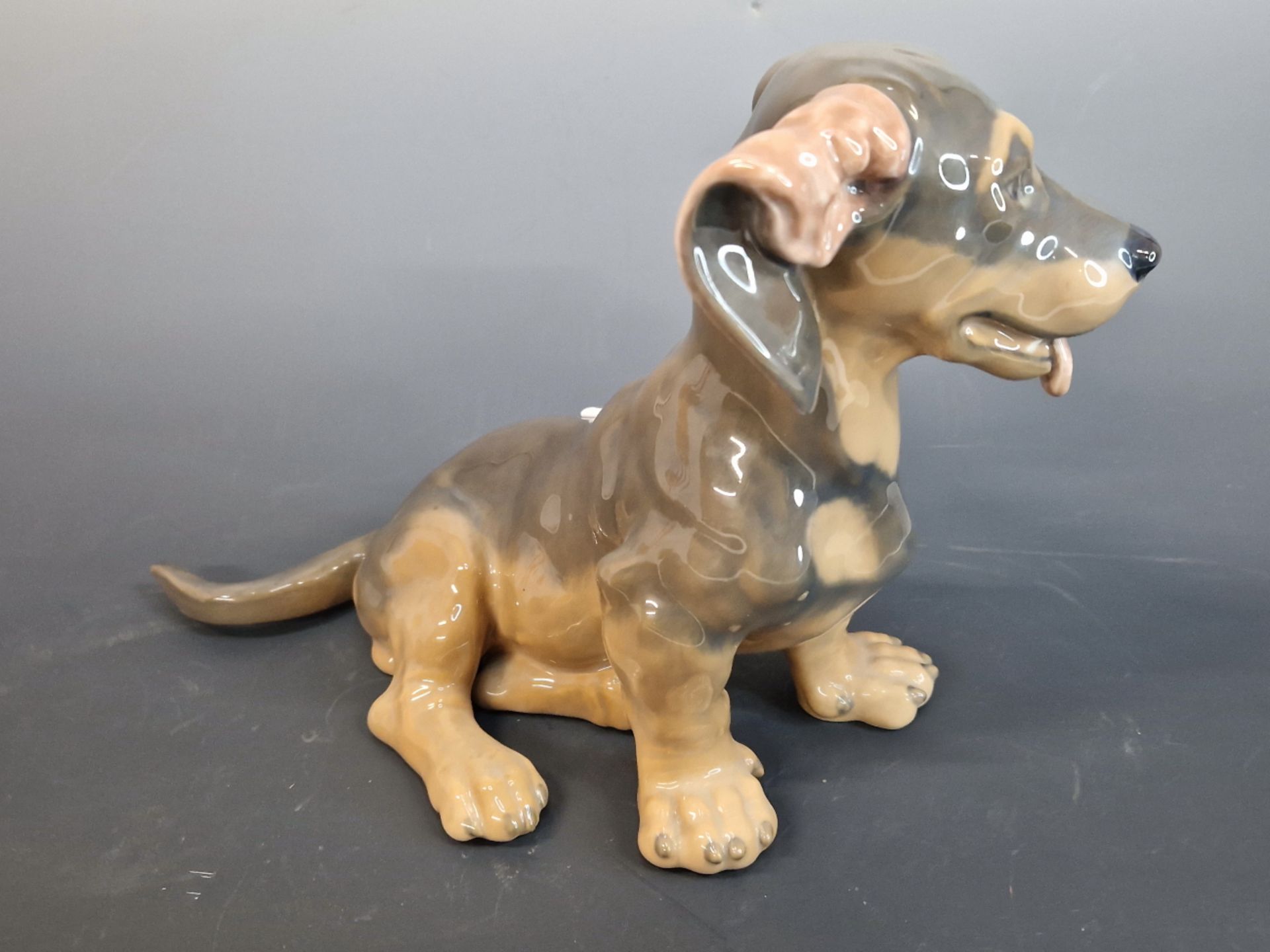 ROYAL COPENHAGEN- A PORCELAIN FIGURE OF A SEATED PUPPY NUMBERED 856. 18 cm HIGH. TOGETHER WITH A - Image 3 of 4