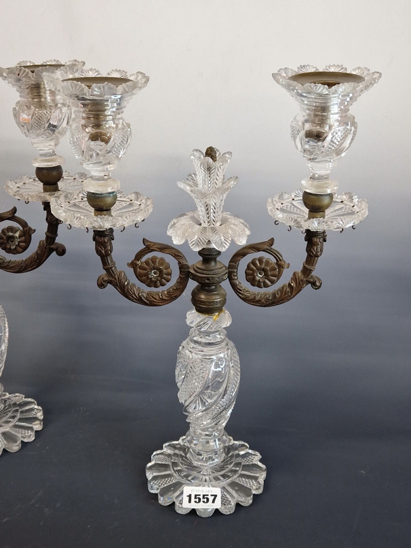 A PAIR OF CUT GLASS AND BRONZE TWO LIGHT LUSTRE CANDELABRA SUPPORTED ON PETAL FEET. H 34cms. - Image 2 of 6