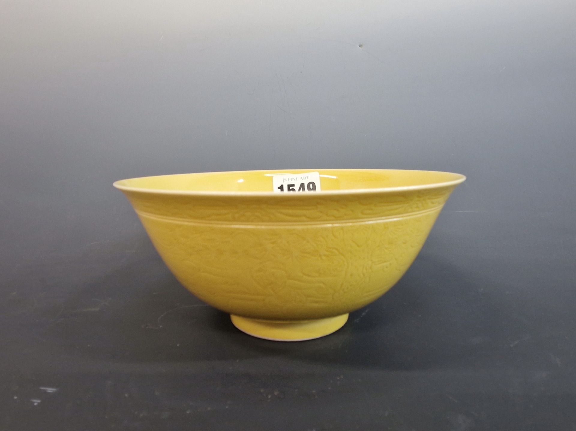 A CHINESE STRAW YELLOW GLAZED BOWL, THE EXTERIOR WITH A SCRATCHED DECORATION OF CHILDREN PLAYING