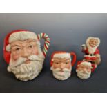 ROYAL DOULTON, SANTA CLAUS. A GRADUATED GROUP OF THREE CHARACTER JUGS TOGETHER WITH A FATHER