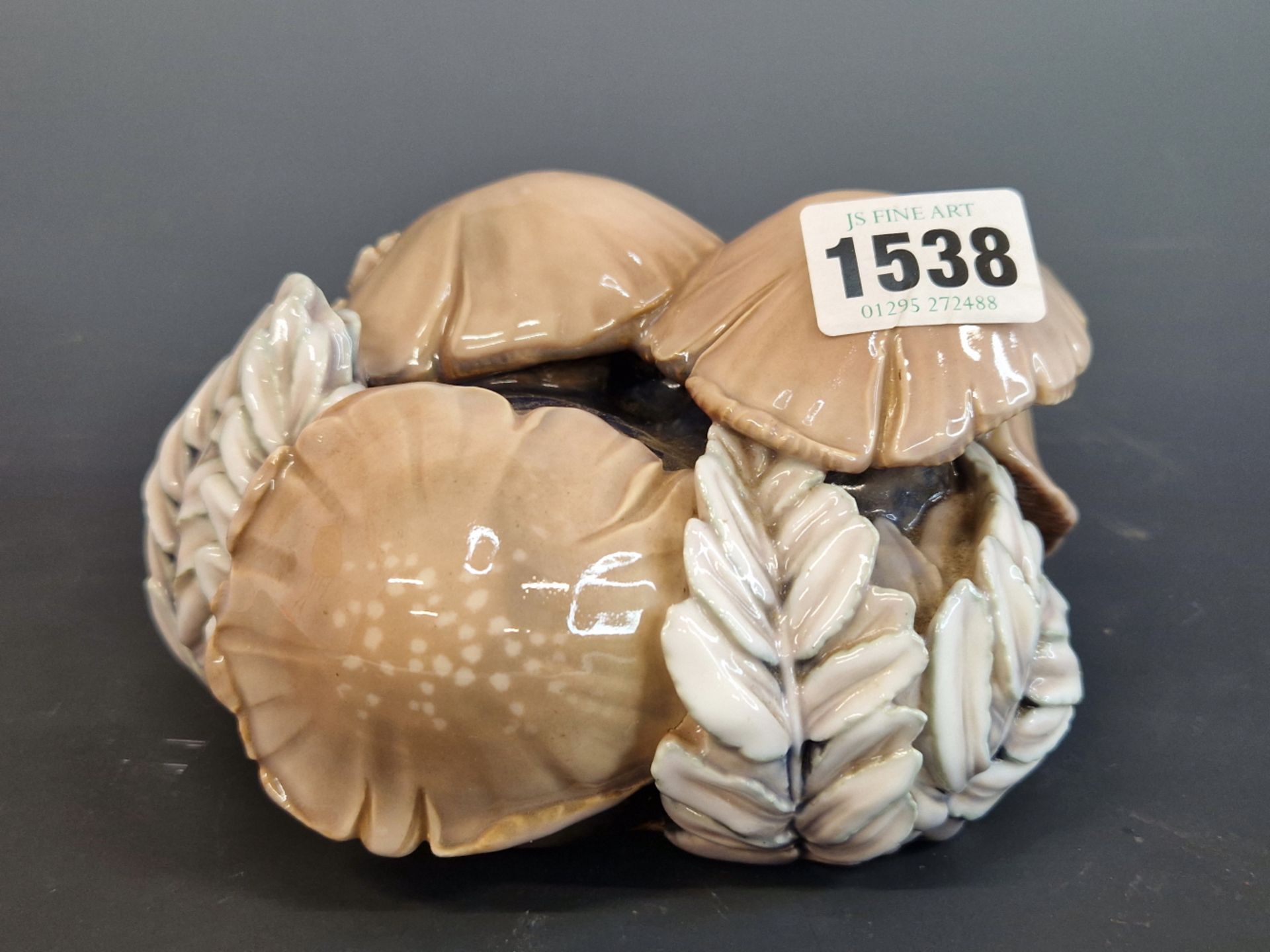 A BING AND GRONDAHL, COPENHAGEN PORCELAIN GROUP OF FUNGI GROWING AMONGST BRACKEN. W 14cms.