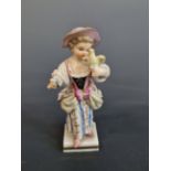 MEISSEN- A SMALL ANTIQUE FUGURINE OF GIRL HOLDING A BIRD. 10 cm HIGH.