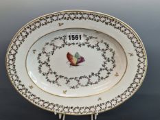 A COZZI PORCELAIN OVAL DISH PAINTED WITH A CENTRAL BUTTERFLY WITHIN TWO GUILLOCHE BANDS OF LEAVES