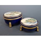 FUZAN, TWO JAPANESE SATSUMA BLUE GROUND CYLINDRICAL BOXES WITH COVERS PAINTED WITH COASTAL