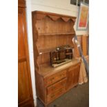 Victorian pine kitchen dresser with three drawers and a panelled door, 121cm wide