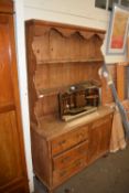 Victorian pine kitchen dresser with three drawers and a panelled door, 121cm wide