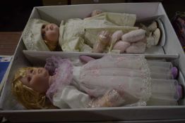 Box containing two porcelain dolls from the Leonardo collection with certificate