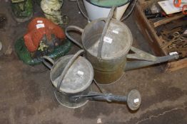 Two vintage watering cans