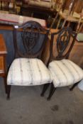 Pair of mahogany shield back dining chairs